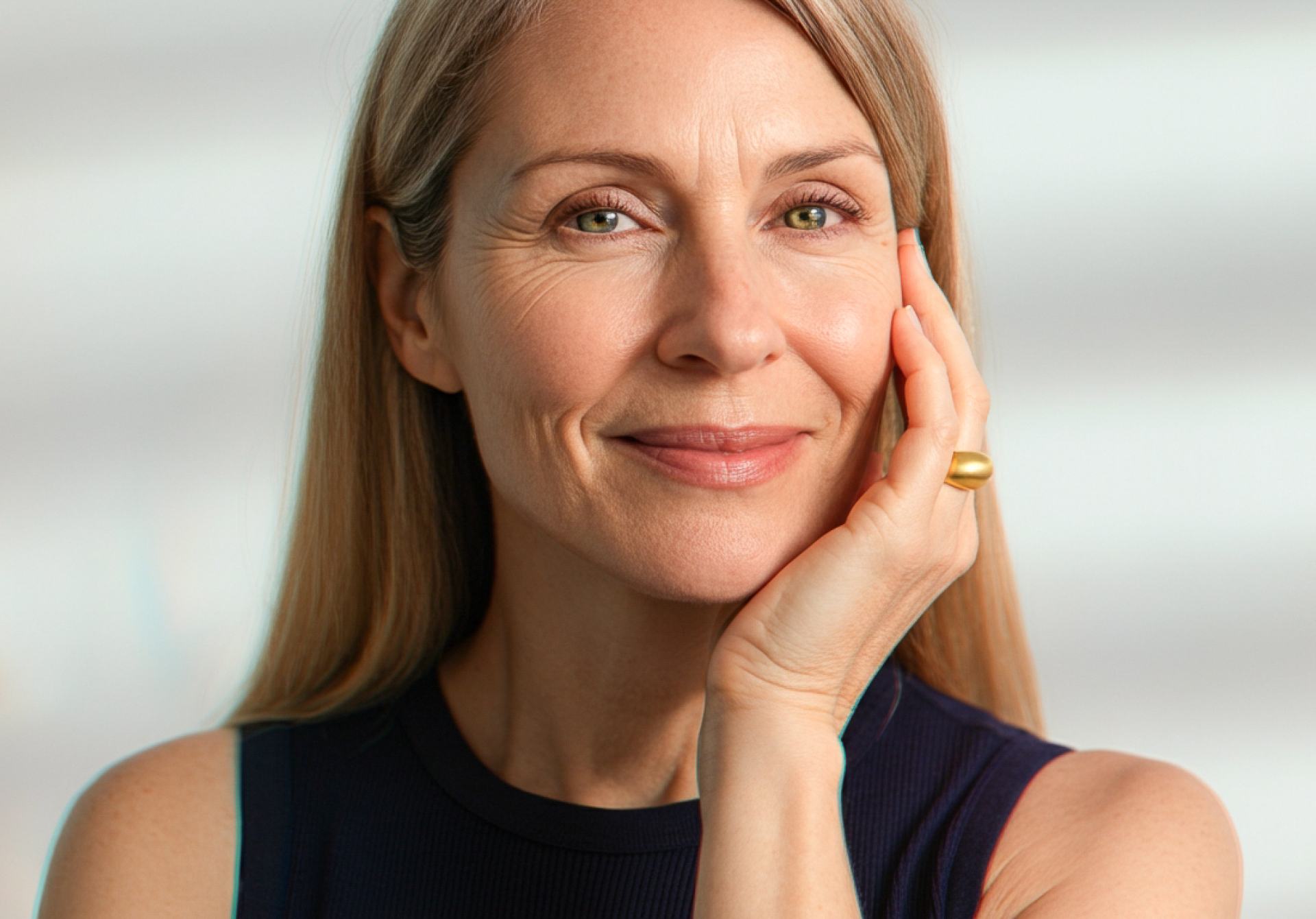 Close-up of a smiling woman with natural makeup