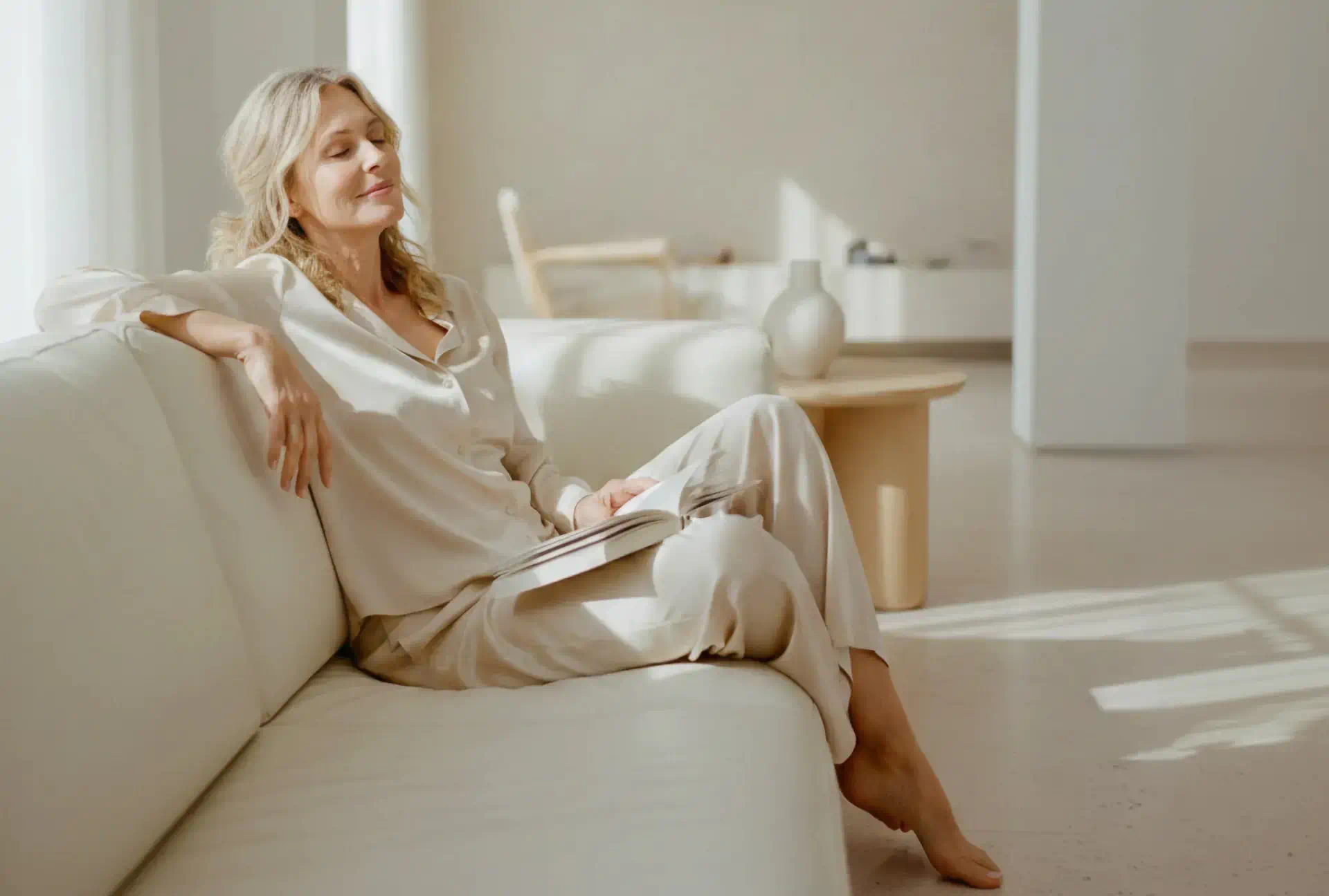 Woman relaxing on a sofa while reading
