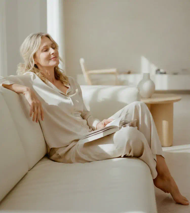 Woman relaxing on a sofa while reading