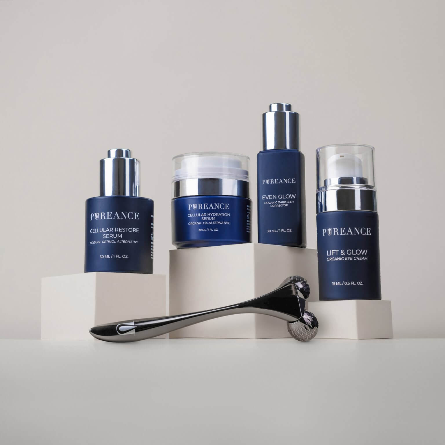 Four Pureance skincare products on podiums with a roller displayed