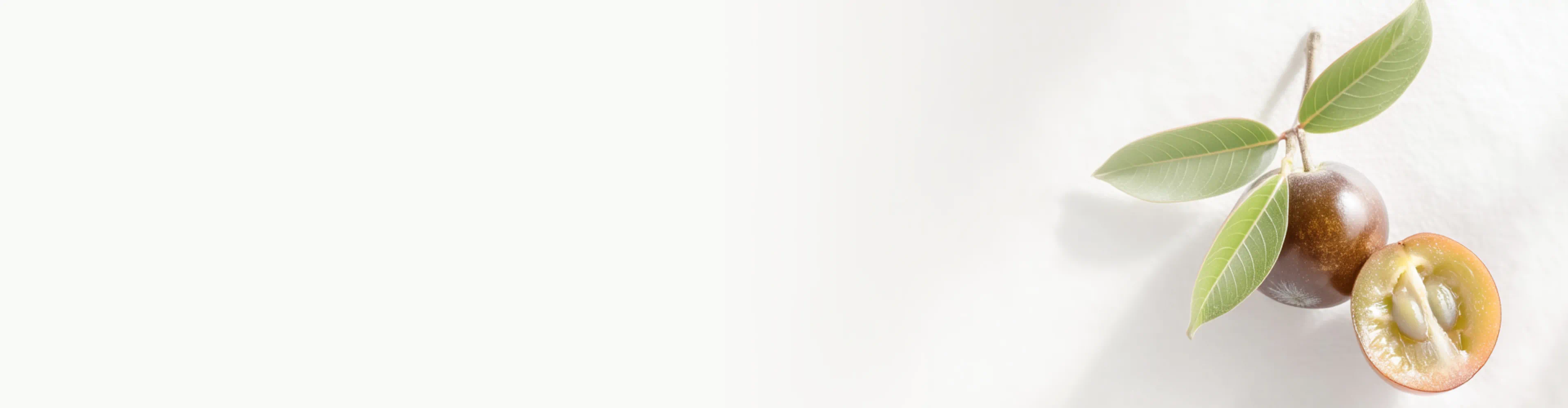 Whole and halved Camu Camu berries with green leaves