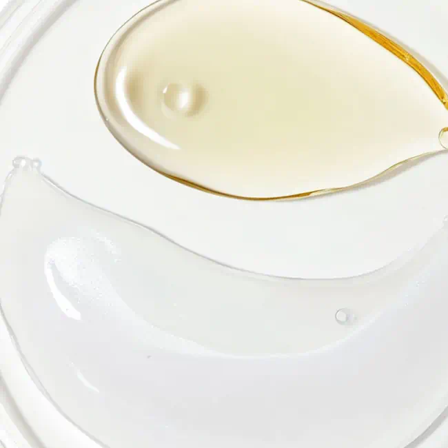 Close-up of two different skincare textures on a white surface