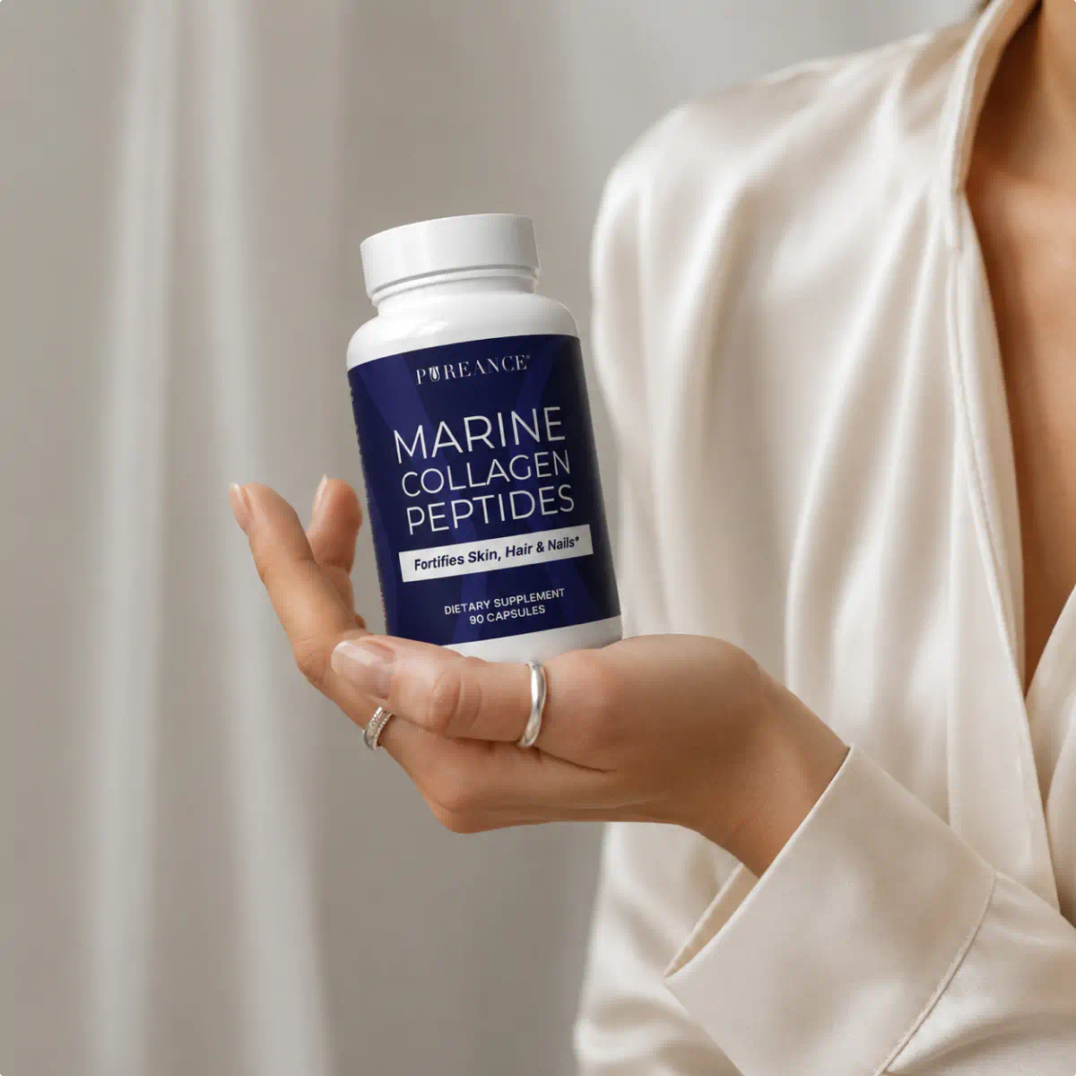 Woman holding Pureance Marine Collagen Peptides supplement bottle