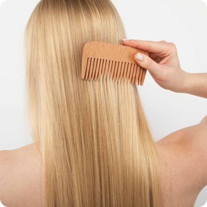 woman brushing her hair